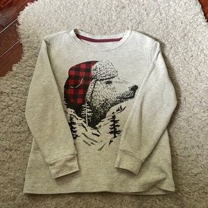 Gray long sleeve boys shirt.